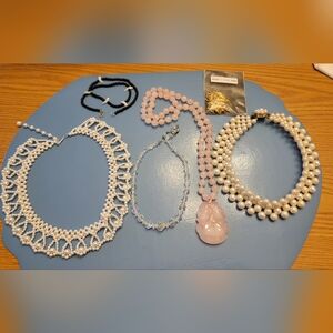 This bundle is a collection of vintage style pretty assorted Costume necklaces.